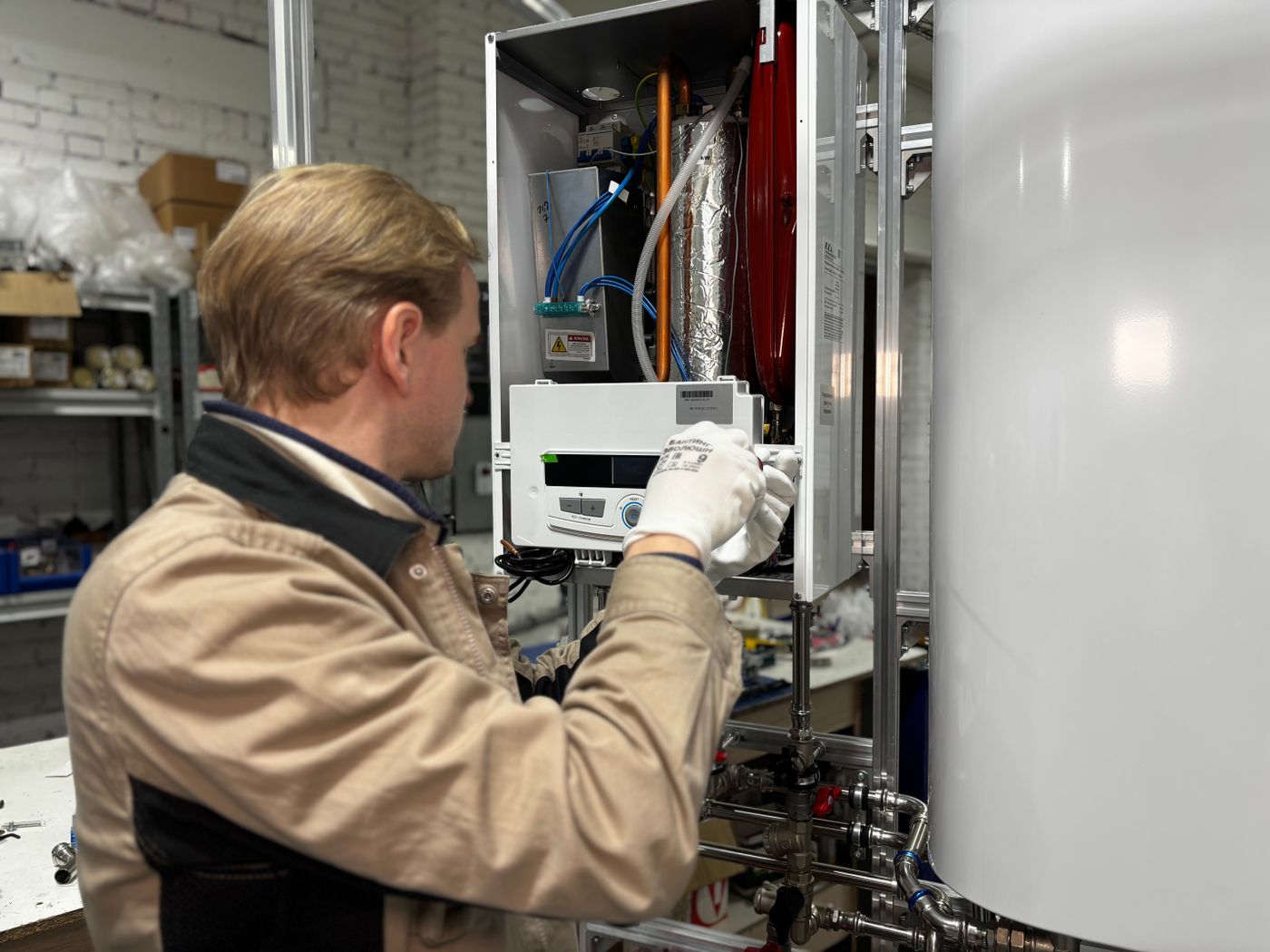 A technician servicing a cooling unit